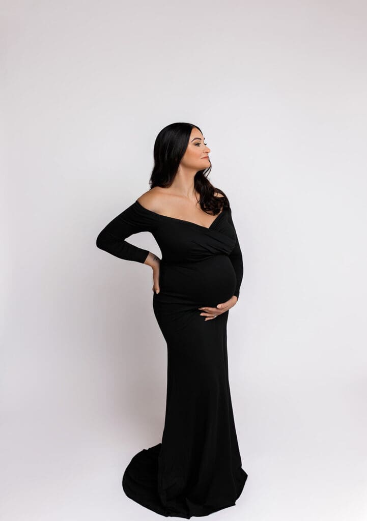 Modern maternity photo session in black dress