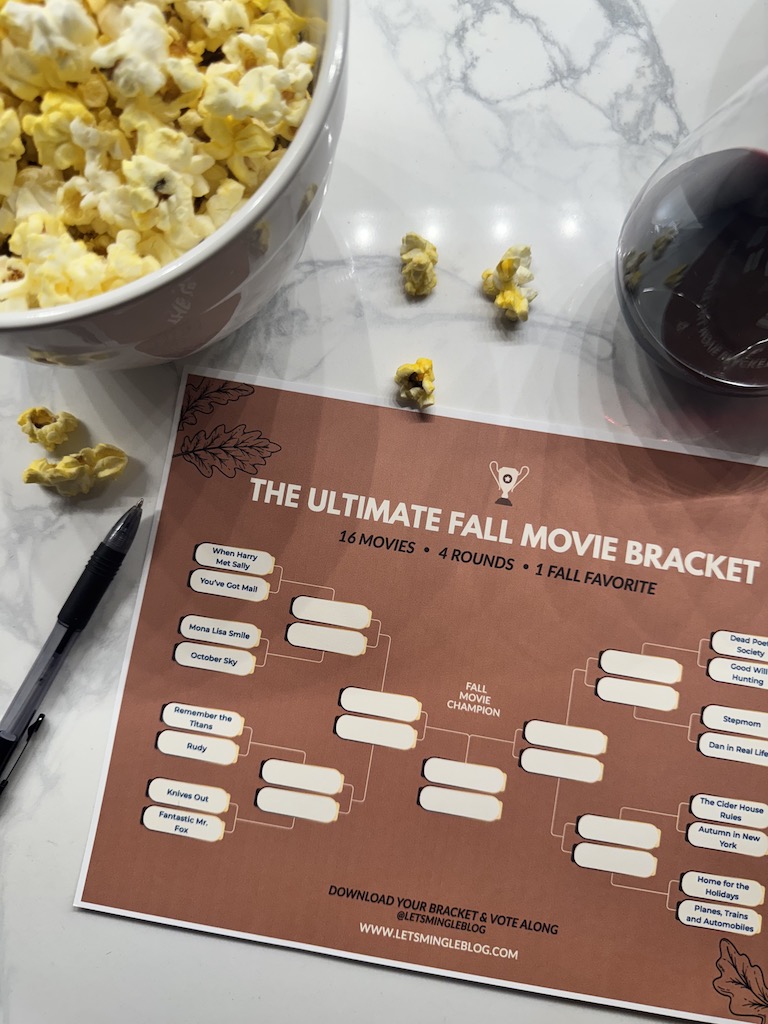 Fall movie challenge bracket with popcorn, wine and a pen